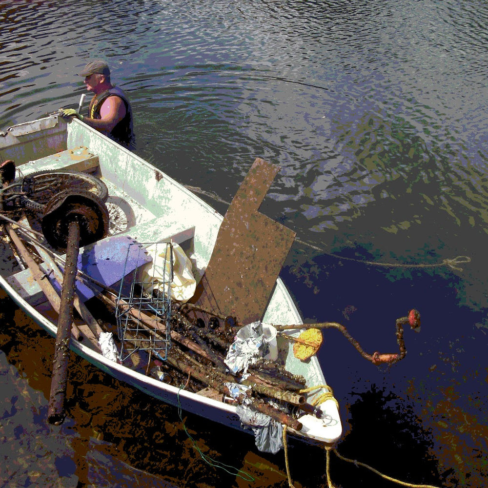 doug-snedden-with-a-boat-full-of-waste